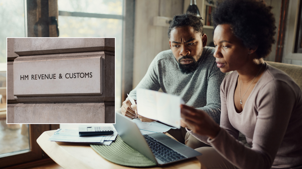 Couple worried looking at taxes