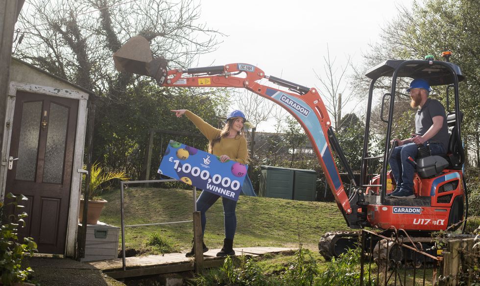 Craig and Zoe Haggie with National Lottery cheque