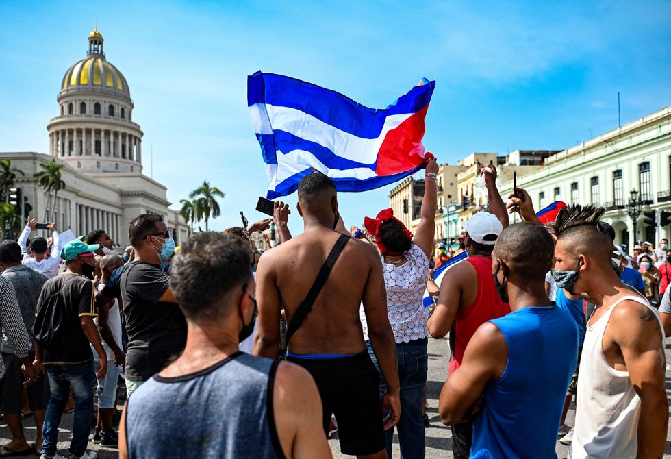 Cubans are seen outside Havana's Capitol during a demonstration against the government of Cuban President Miguel Diaz-Canel in Havana