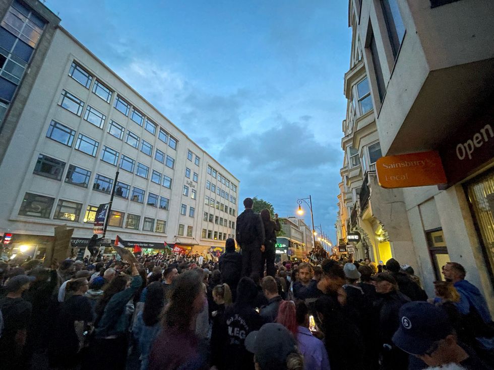 Demonstrators and police gather in Brighton