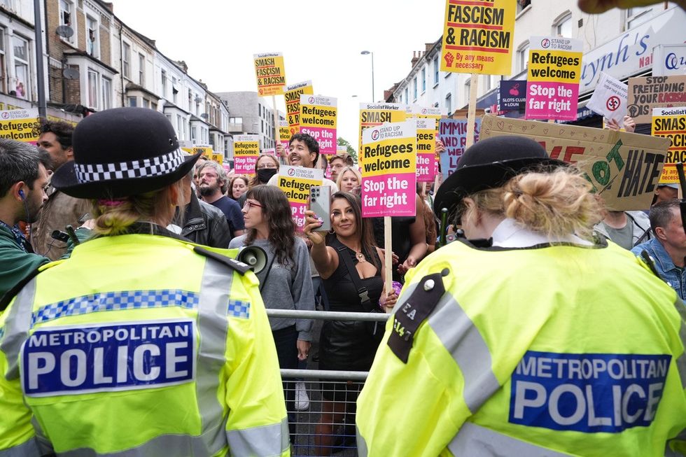 Demonstrators and police officers at an anti-racism protest in Walthamstow, London