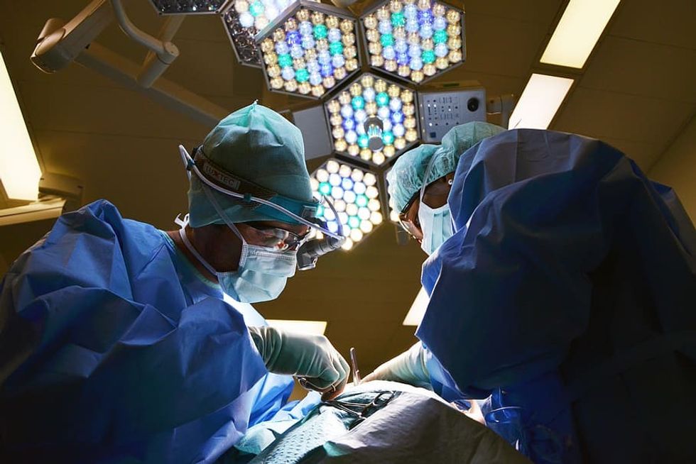 Doctors performing surgery (stock footage)