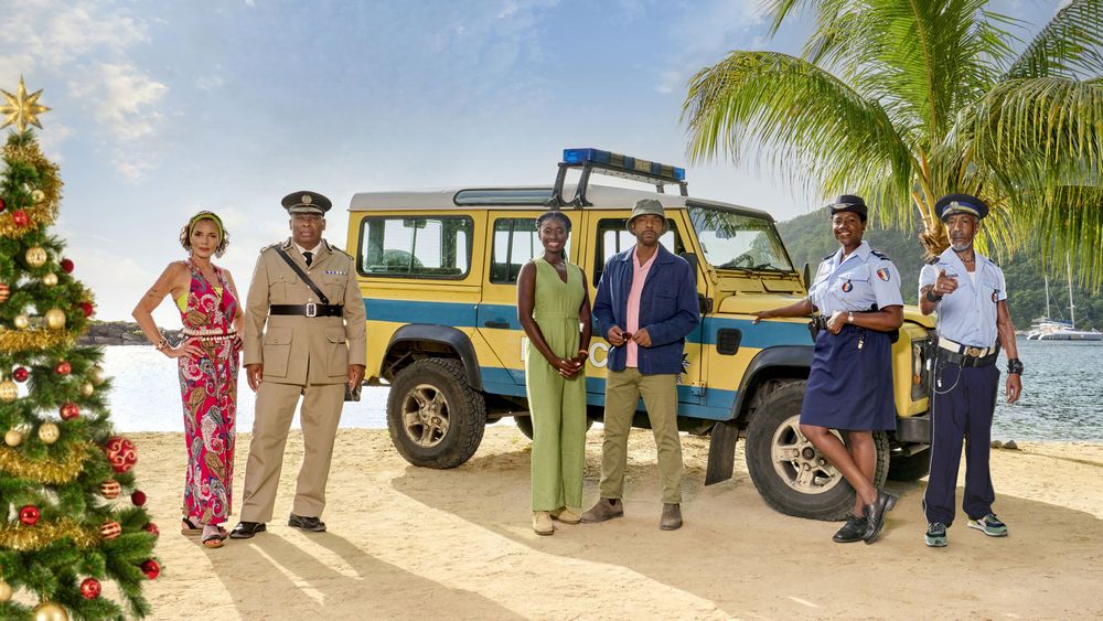 Don Gilet and Death in Paradise cast