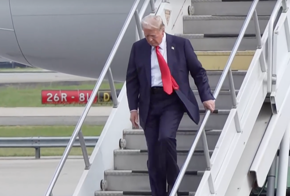 Donald Trump steps off the Trump plane