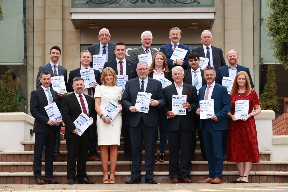 Doug Beattie (front centre), leader of the Ulster Unionist Party (UUP) stands with party candidates following the party's manifesto launch at the Stormont Hotel in Belfast