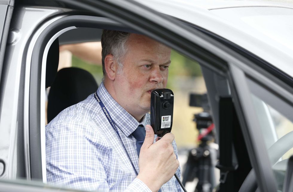 Driver with a breathalyser