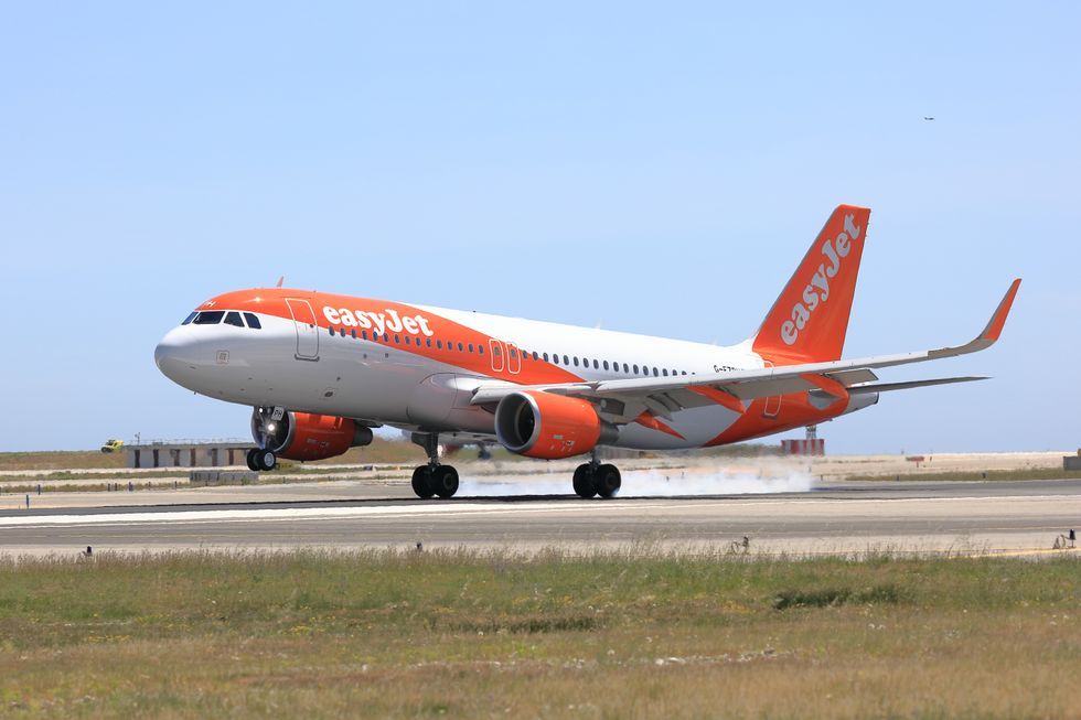 EasyJet plane with its new livery landing at an airport