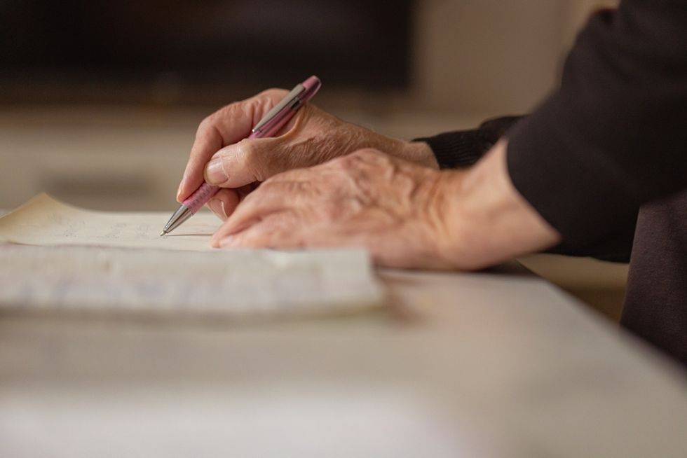 Elderly person signing will