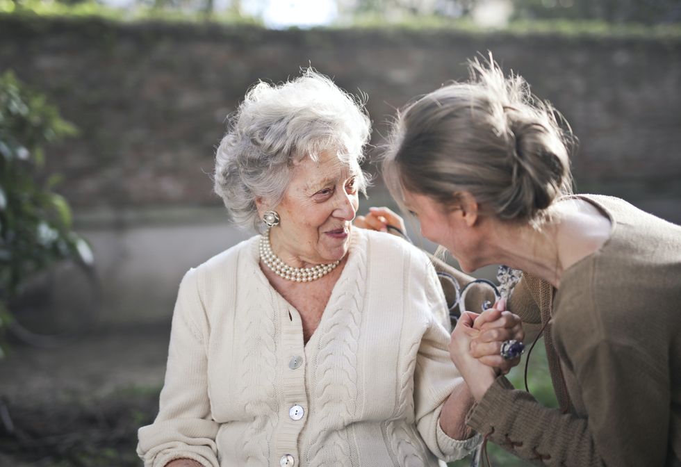 Elderly woman with young person