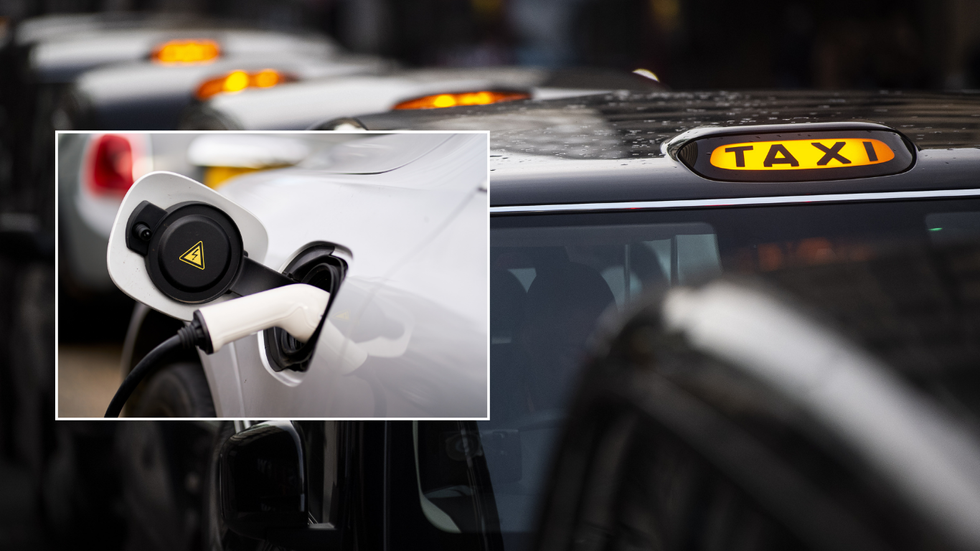 electric car charger and queue of taxis