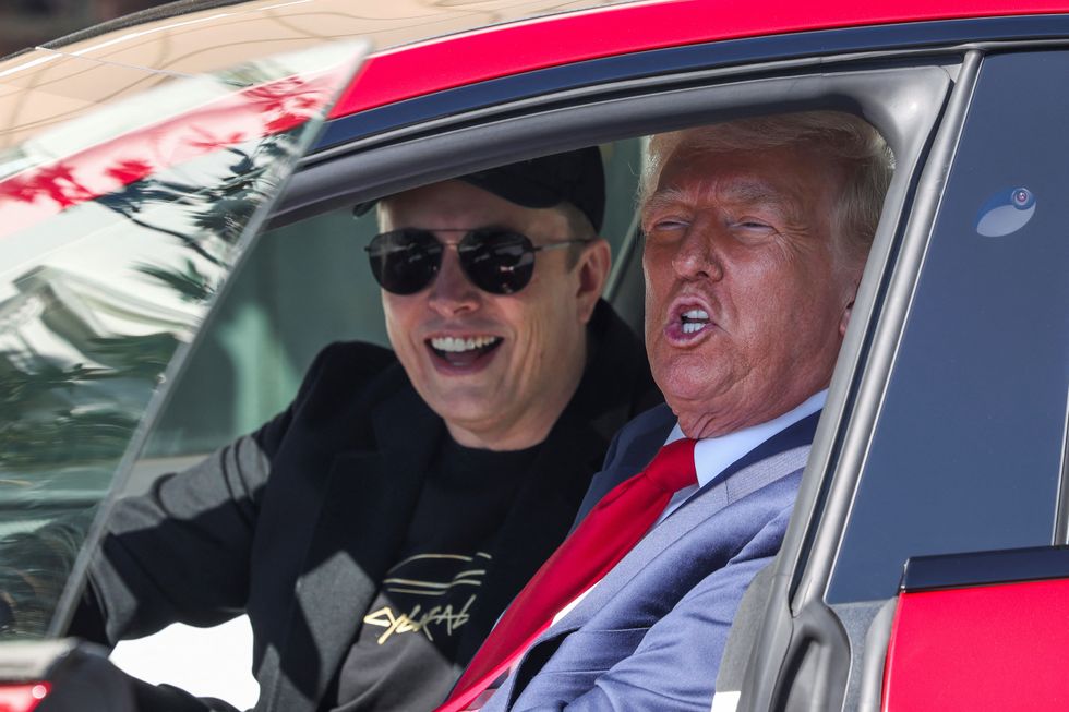 Elon Musk and President Donald Trump sitting in a Tesla