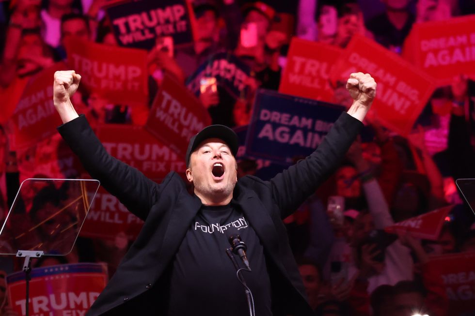 Elon Musk cheering at a Donald J Trump rally in the run up to the US election