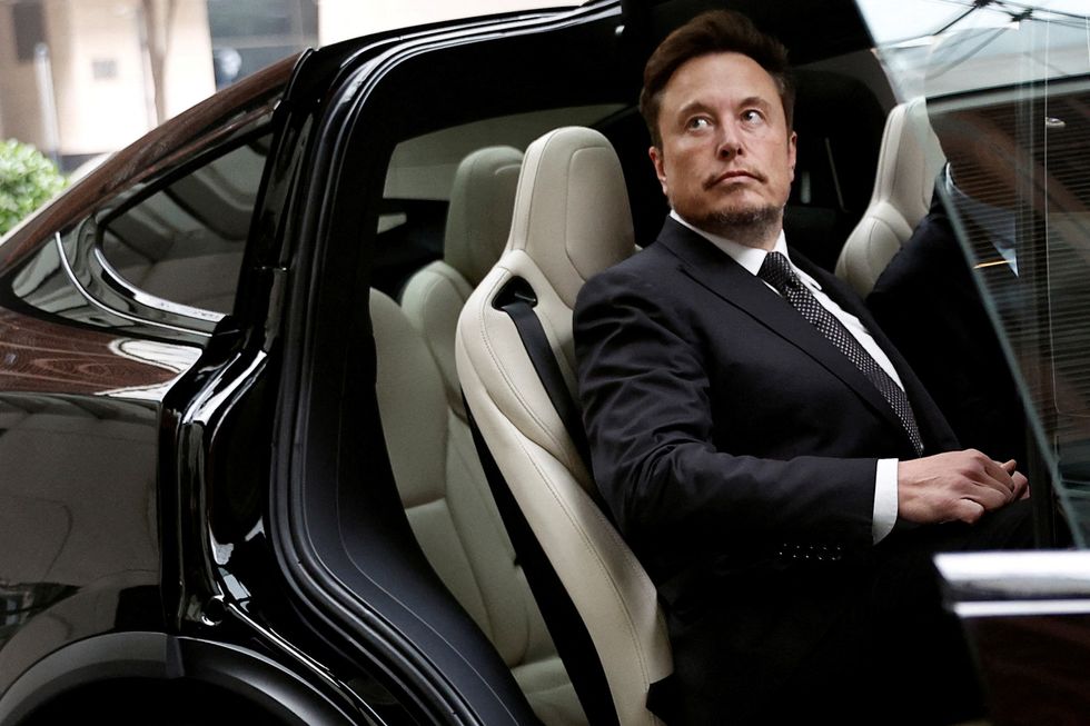 Elon Musk in a Tesla