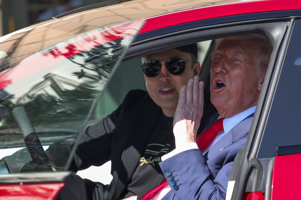 Elon Musk with Donald Trump inside a new Tesla model