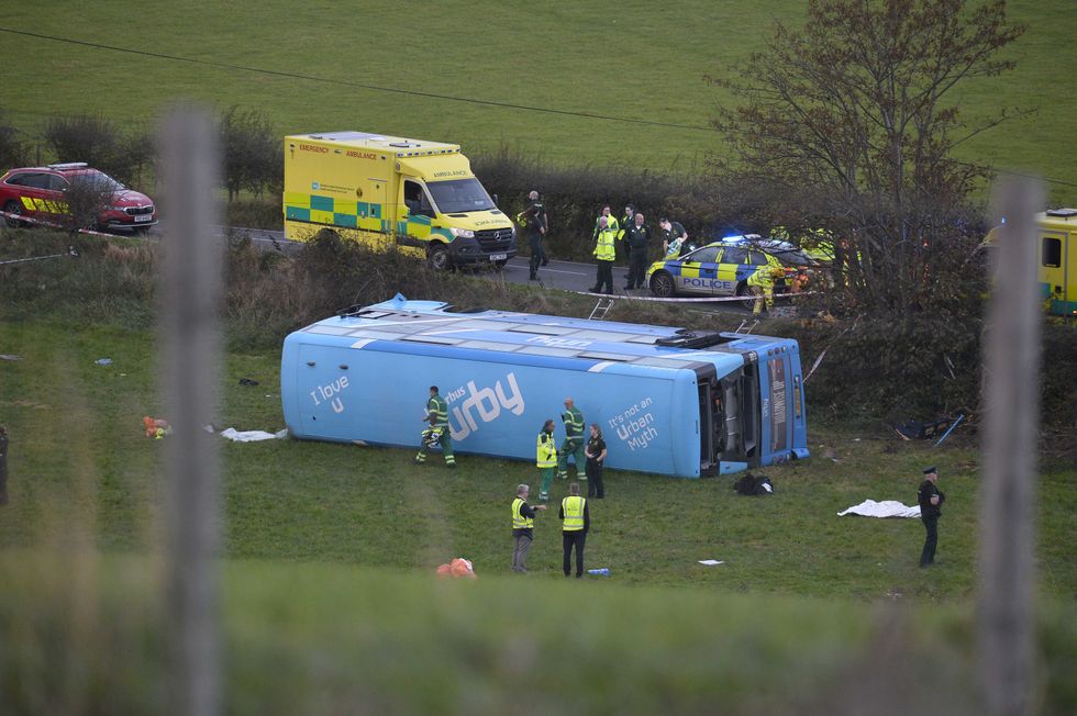 Emergency workers at the scene of a school bus crash on the Ballyblack Road East near Carrowdore in Northern Ireland