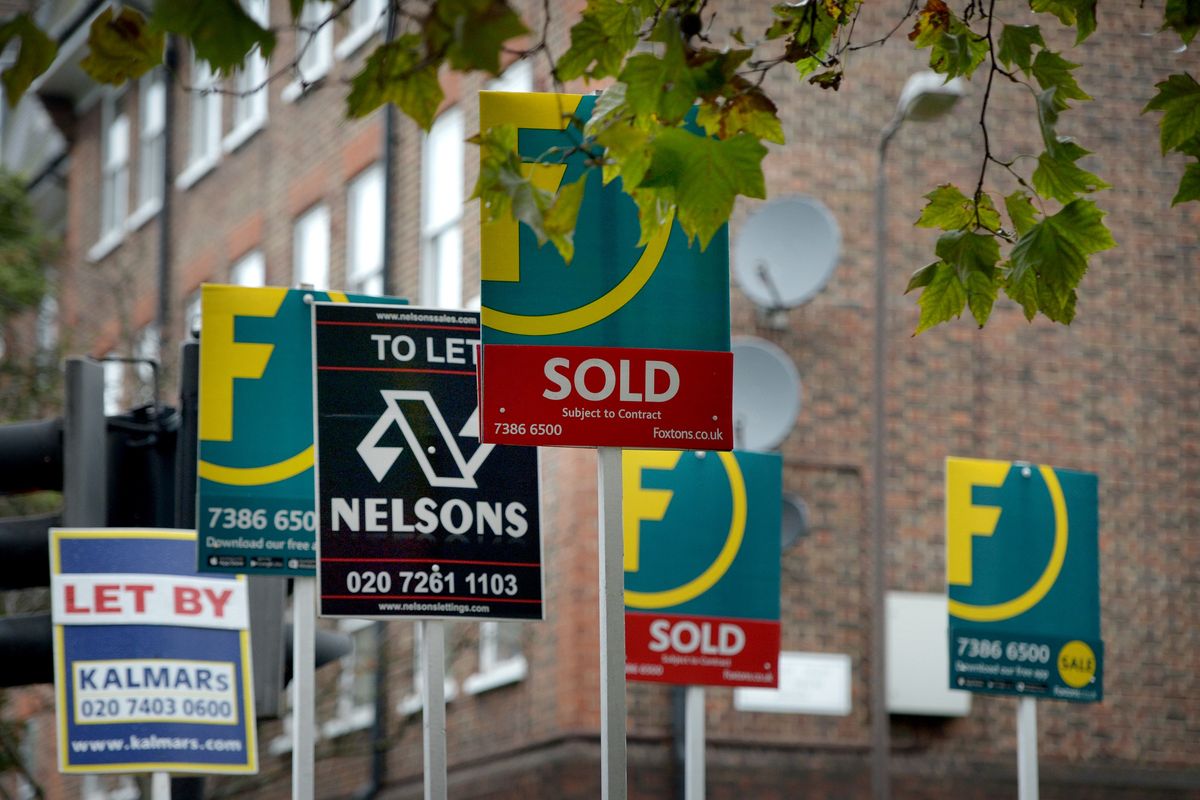 Estate agents signs outside flats on the Old Kent Road in London