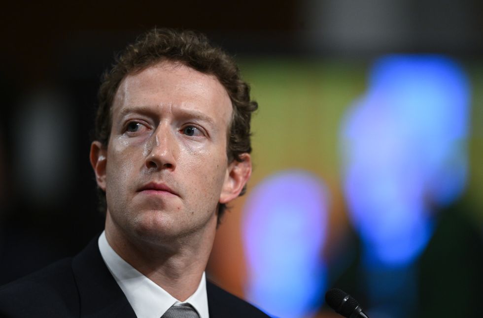 facebook co-founder mark zuckerberg in a suit looking concerned