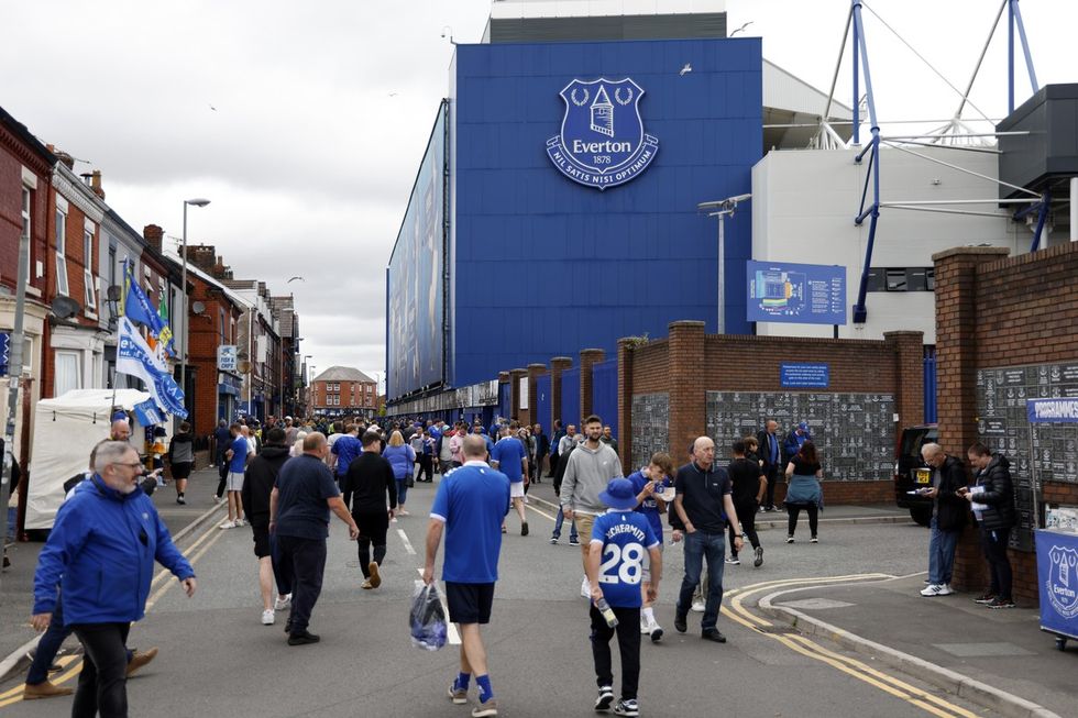 Fans arrive ahead of the Premier League match at Goodison Park, Liverpool