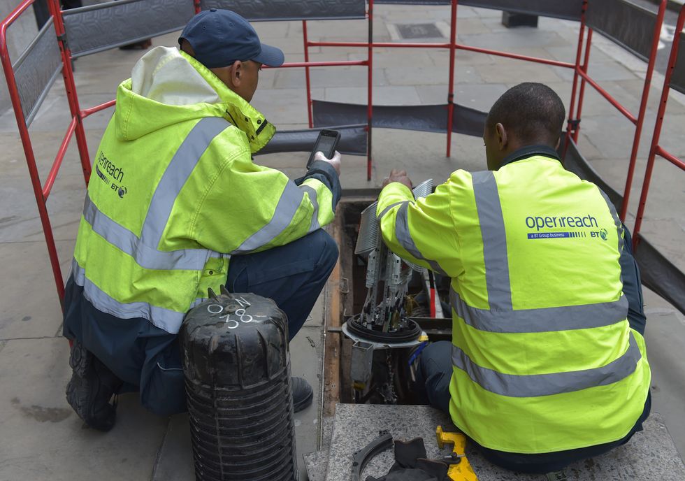 Fibre broadband engineers from Openreach, the infrastructure arm of BT work on a fibre cable junction in central London