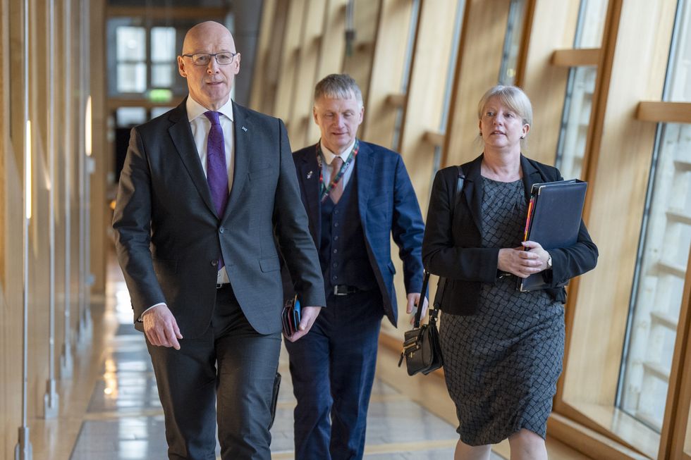 Finance Secretary Shona Robison arrives with First Minister John Swinney (left) and Ivan McKee (centre) at the main chamber for the Scottish Budget Stage 1 Debate at the Scottish Parliament in Holyrood