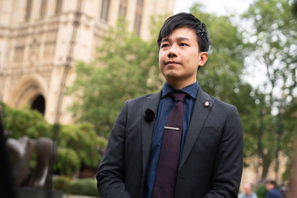 Finn Lau talks to the media on College Green, London