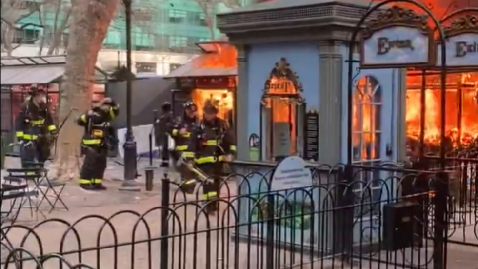 Firefighters and fire at market