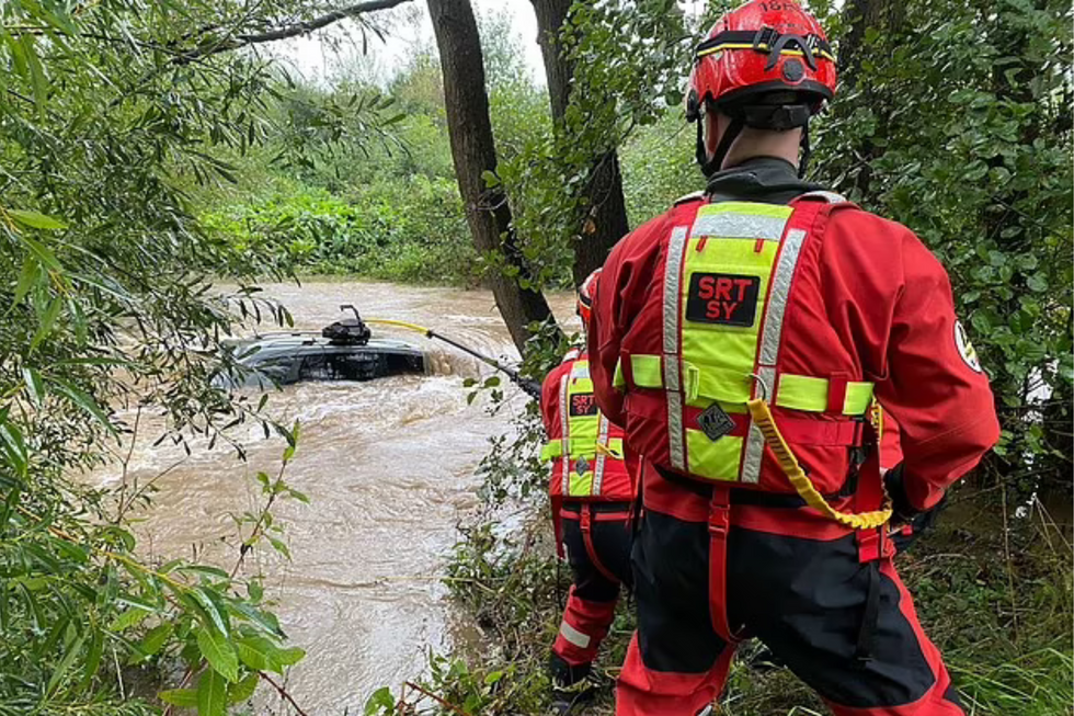 Firefighters pulling car