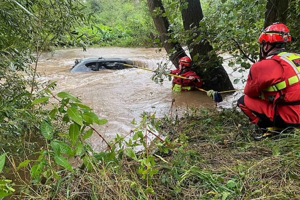 Firefighters rescuing car