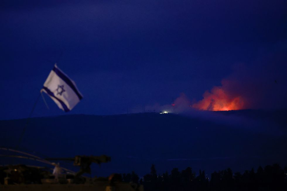 Flame and smoke rise over Lebanon as seen from Israel's border with Lebanon