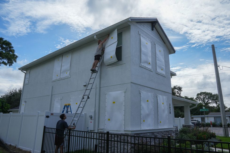 Florida residents boarding up their houses