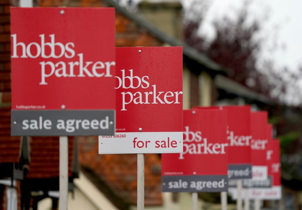 For sale and sale agreed signs in a row