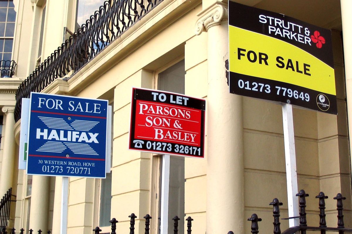 For sale signs outside properties