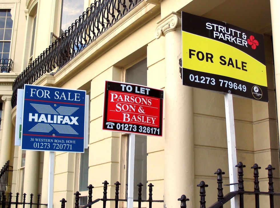 For sale signs outside properties