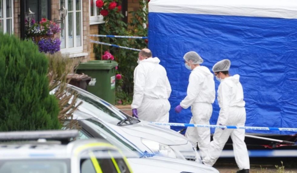 Forensic officers at the scene in Ashlyn Close, Bushey, Hertfordshire