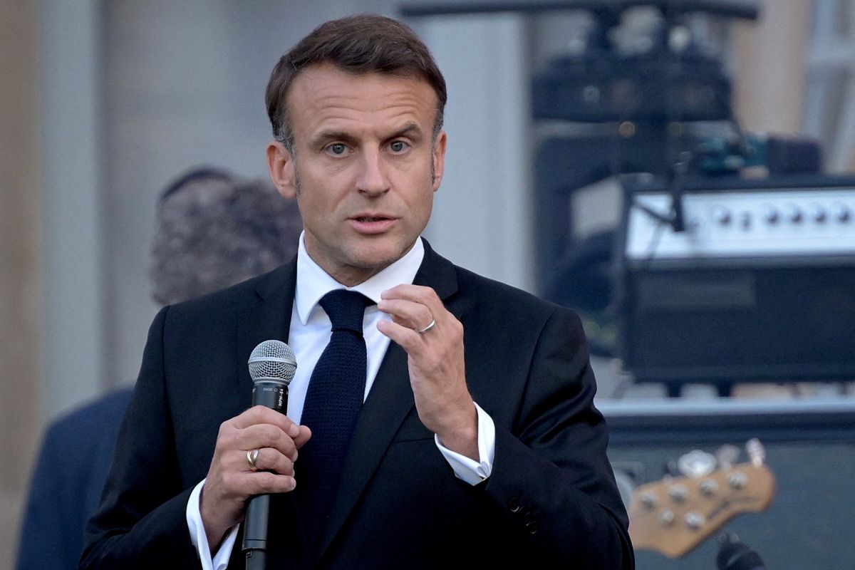 France's President Emmanuel Macron speaks during the annual "Fete de la musique" one-day music festival in the courtyard of the Elysee presidential palace in Paris