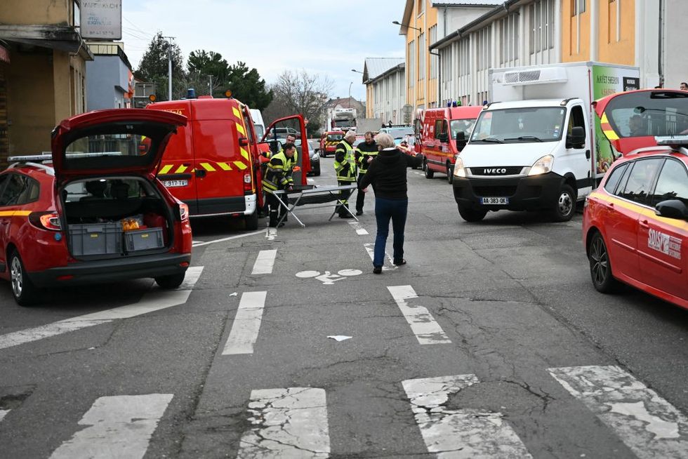 French firefighters operate near the site of the knife attack