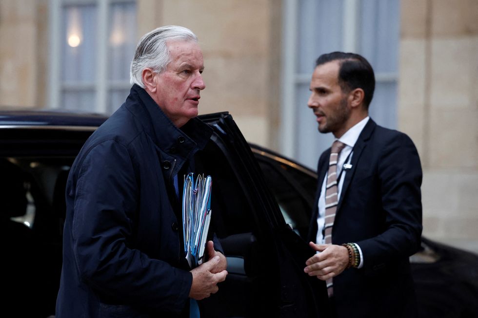 French Prime Minister Michel Barnier arrives to attend a meeting with the newly-named French government