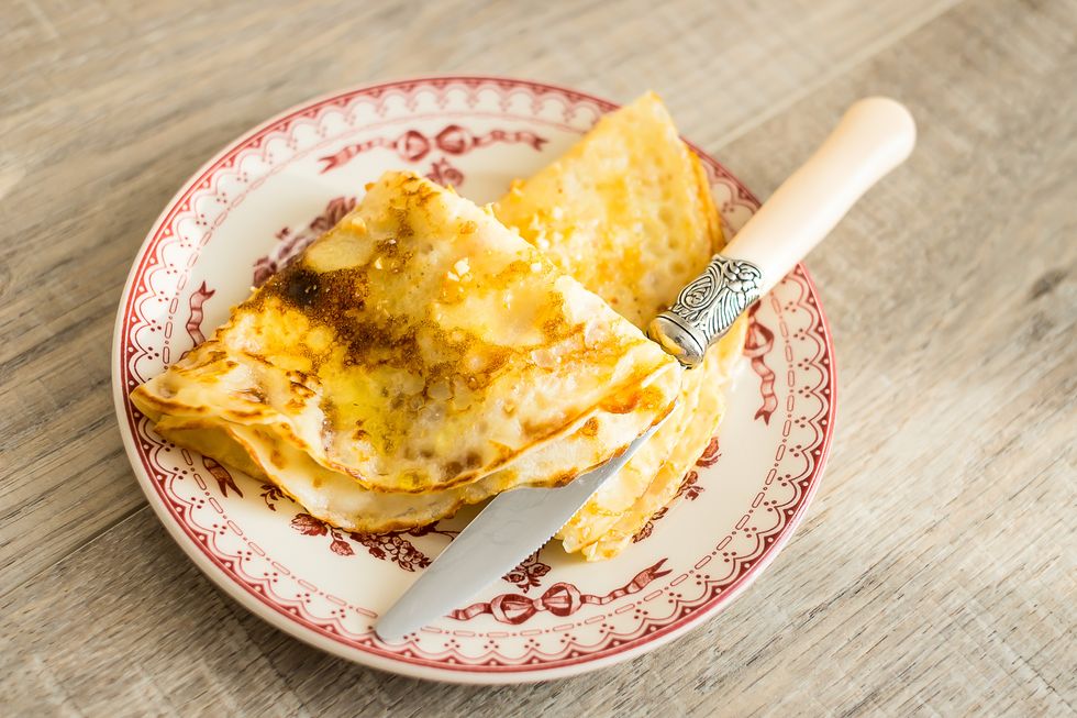 Fried pancakes with honey on a plate