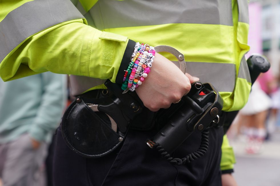 Friendship bracelets worn by a police officer outside Wembley Stadium in north west London, ahead of Taylor Swift's latest Eras Tour concert