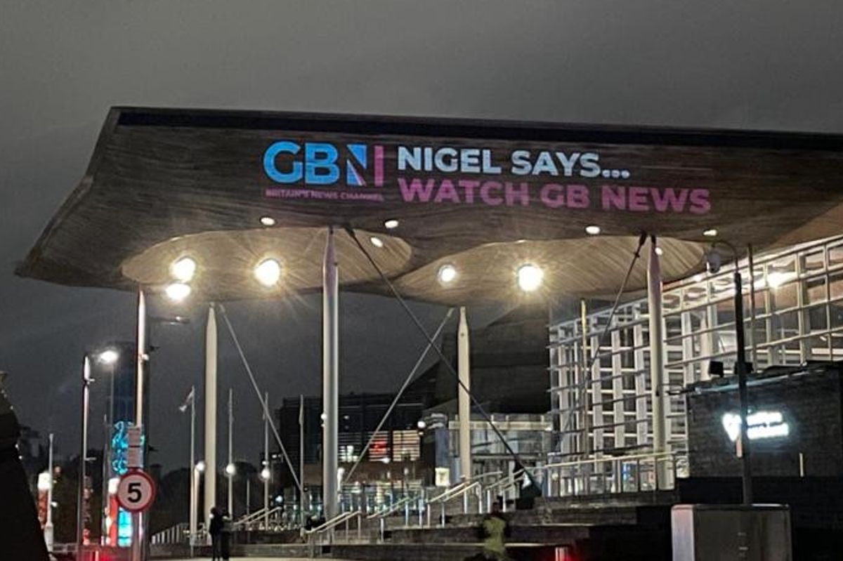 GB News has projected a message onto the Welsh Parliament