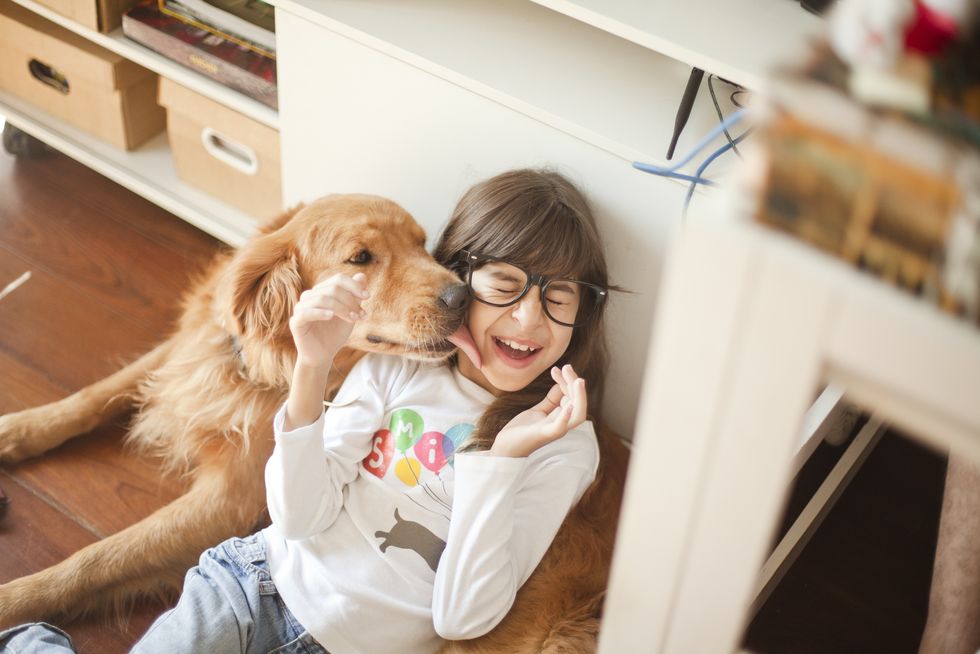 Girl with golden retriever