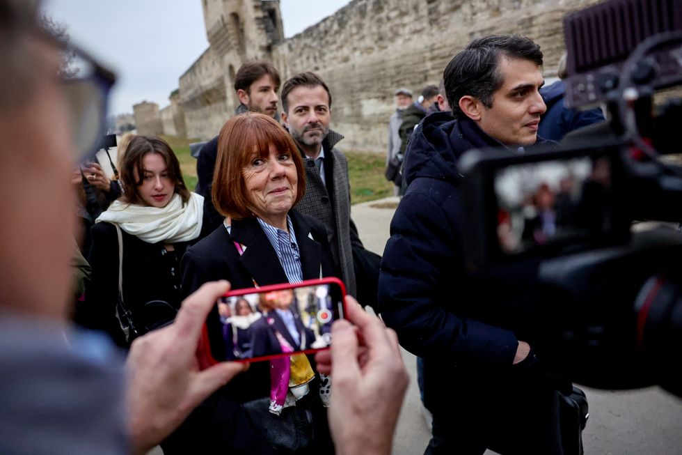 Gisele Pelicot arrives with her lawyers Antoine Camus (C) and Stephane Babonneau (R) at the courthouse in Avignon