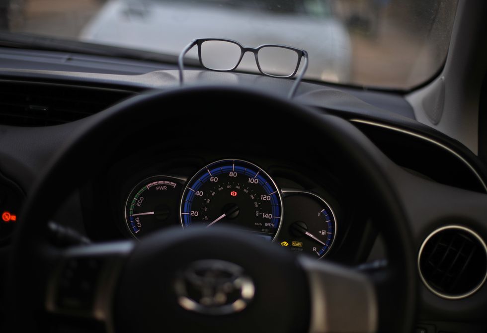 Glasses on a car dashboard