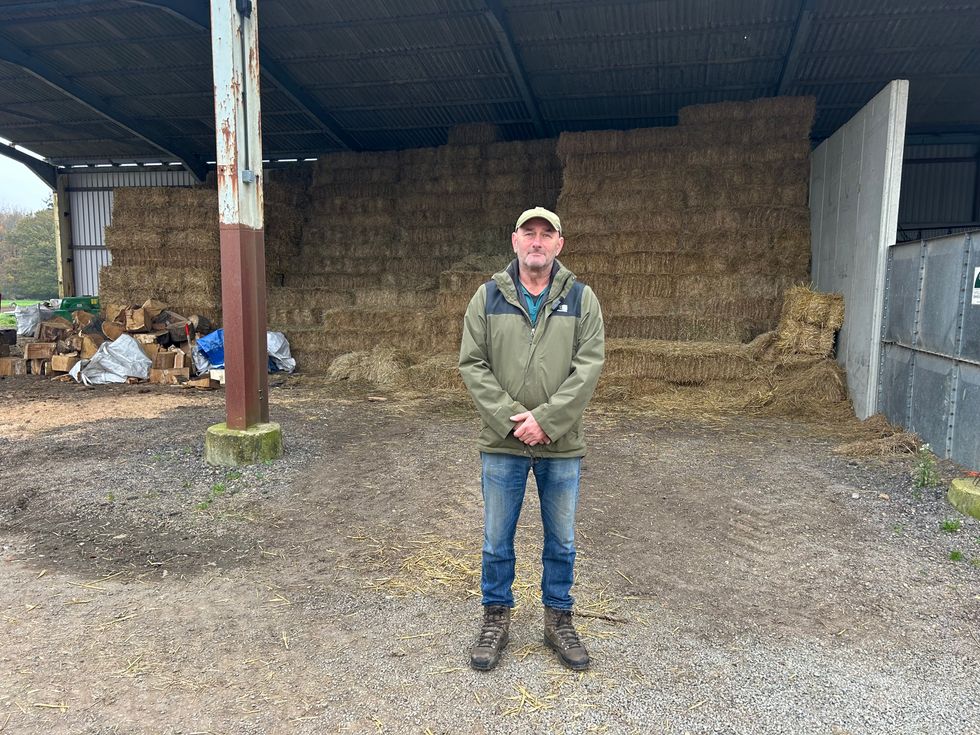 Guy Tucker standing on his farm