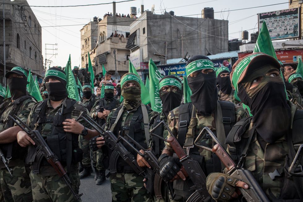 Hamas militants are seen during a military show in the Bani Suheila district