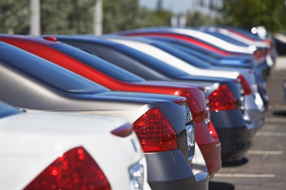 Handing over new car keys (Stock)