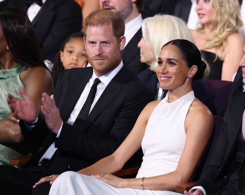 Prince Harry accepts award despite tens of thousands signing petition to  stop him as Meghan Markle watches on