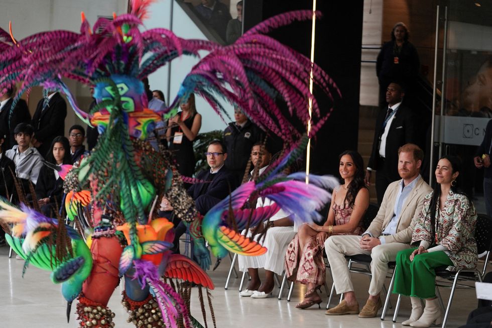 Harry and Meghan watching traditional show