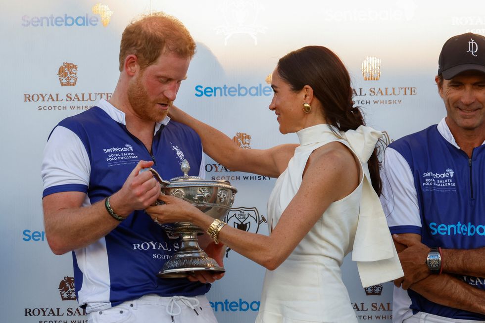 Prince Harry and Meghan Markle share passionate kiss after duke wins ...