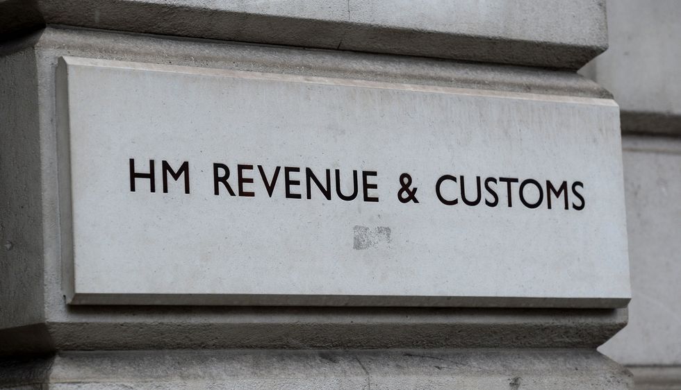 HMRC logo on building wall